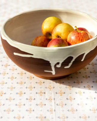 Block print tablecloth featuring orange flower with grey detail on white cotton
