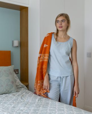 100% cotton vest style pyjamas. Aqua color with navy trim.